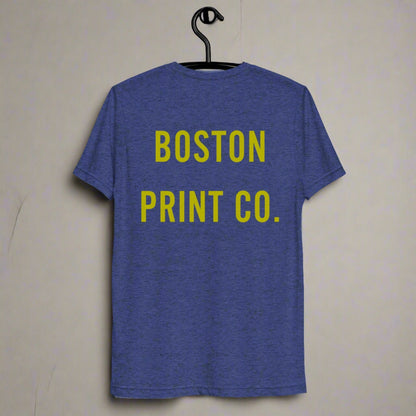 "Eastie" blue and gold t-shirt, 50% polyester, 25% combed ring-spun cotton, 25% rayon, lightweight fabric, pre-shrunk, regular fit, side-seamed construction.