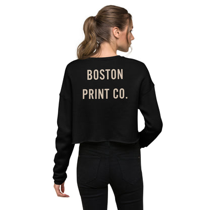 "Made in Boston" crop top, 52% airlume combed and ring-spun cotton, 48% poly fleece, cropped body with raw hem, ribbed crew neckline, and dropped shoulder cut.