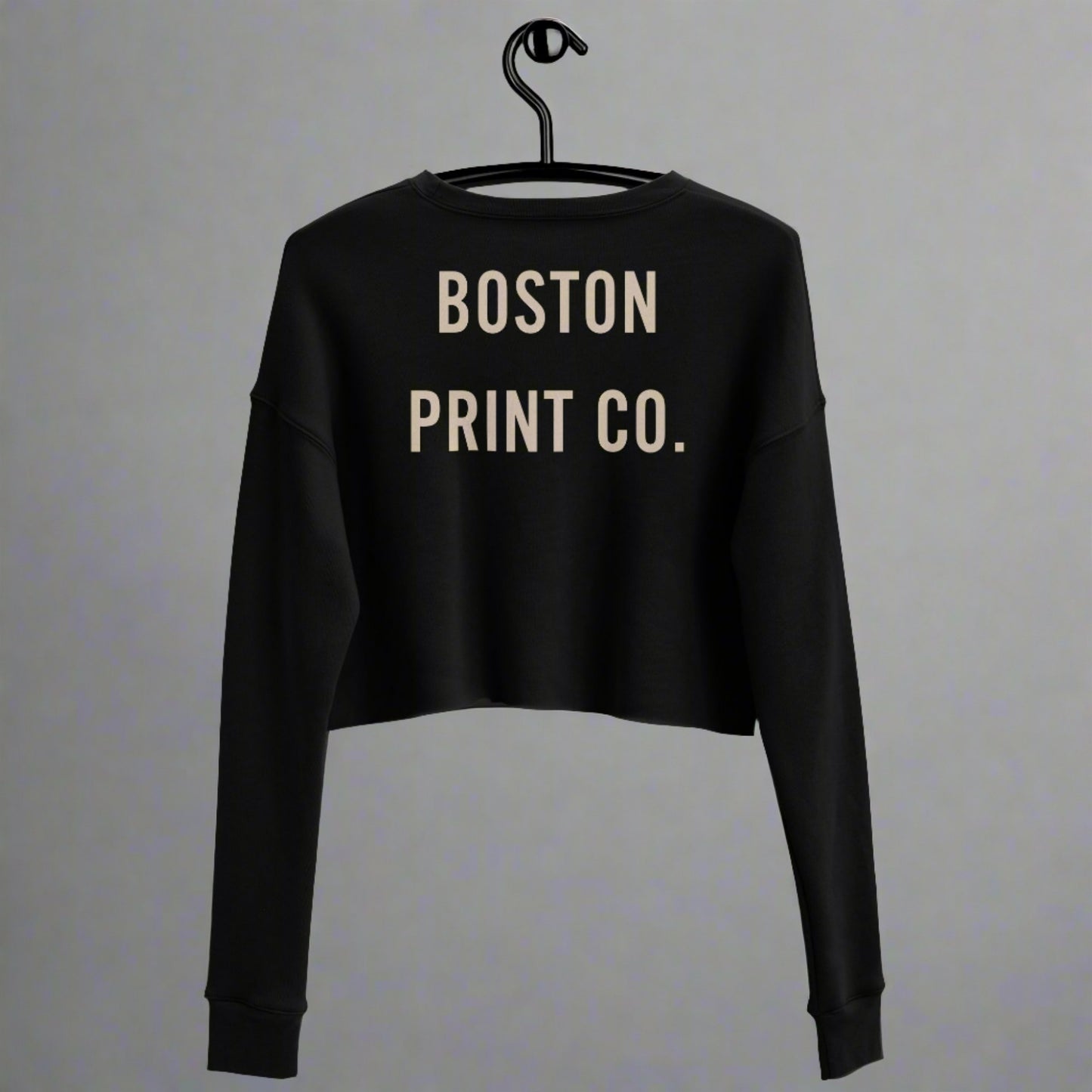 "Made in Boston" crop top, 52% airlume combed and ring-spun cotton, 48% poly fleece, cropped body with raw hem, ribbed crew neckline, and dropped shoulder cut.